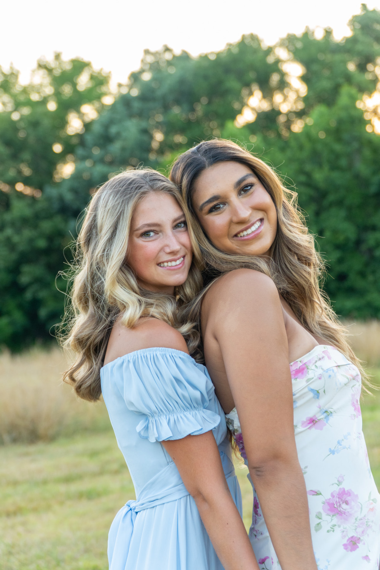 Two friends smiling together outdoors